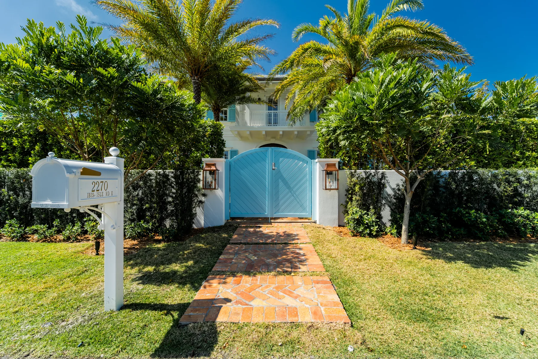 Landscaped front gate and entry at Ibis Isle